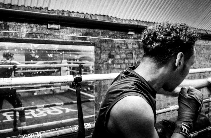 A boxer shadow boxing in a boxing gym